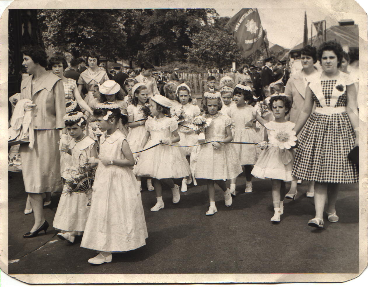 A photograph of children on walking day 1960