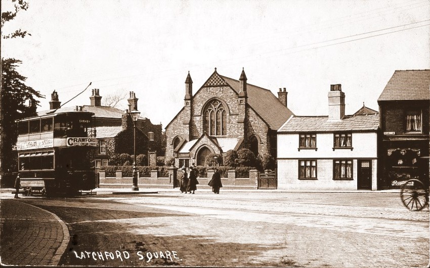 Latchford Square with the church and caretakers cottage in the background. Year 1900's